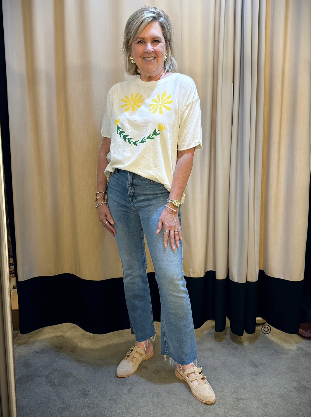 Tania wearing a Free People graphic t-shirt and jeans